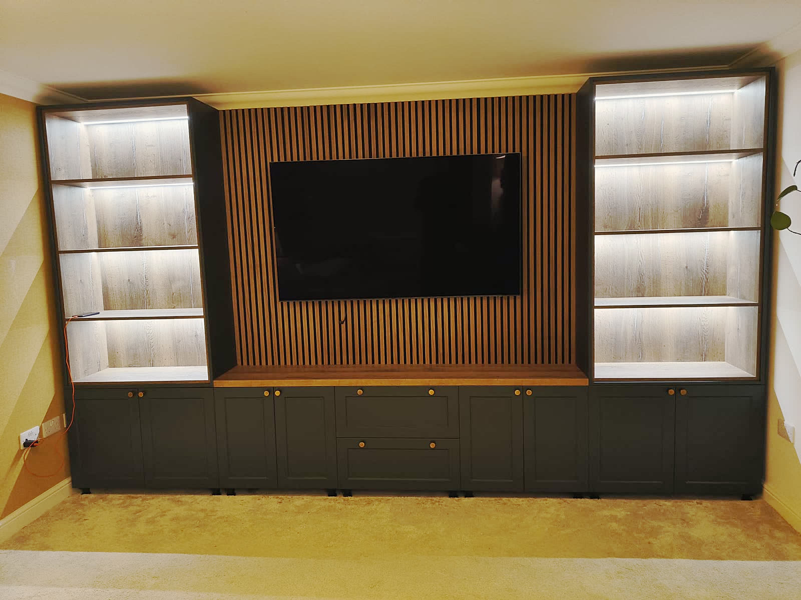 Bespoke Media Wall with Lit Shelving completed project image